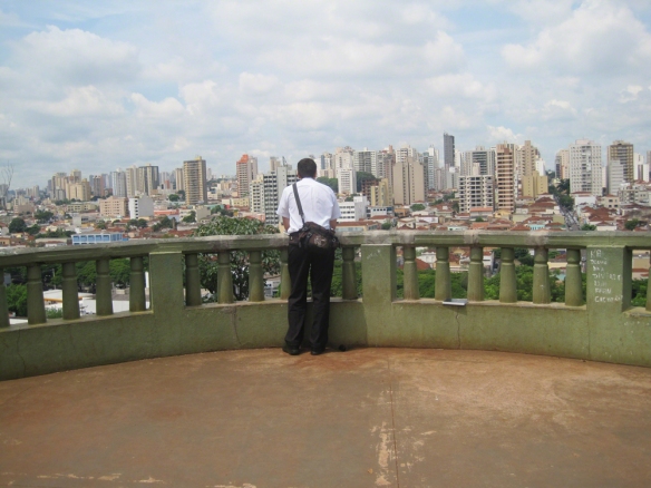 Missionary looking over city scape